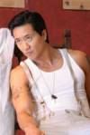 The photo image of Terry Chen, starring in the movie "Stark Raving Mad"