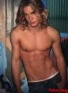 The photo image of Travis Fimmel, starring in the movie "Surfer, Dude"