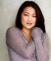 The photo image of Suzy Nakamura, starring in the movie "Stark Raving Mad"