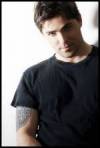 The photo image of Kavan Smith, starring in the movie "Stark Raving Mad"