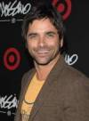 The photo image of John Stamos, starring in the movie "Never Too Young to Die"