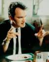 The photo image of Quentin Tarantino, starring in the movie "Reservoir Dogs"